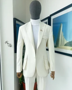 An Ivory white, x-large combat patch pocket, peak lapel suit
