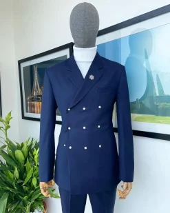 An Navy blue “ibiza” wrap suit with snap buttons detailing