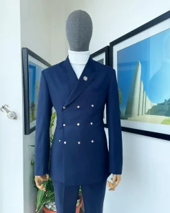 An Navy blue “ibiza” wrap suit with snap buttons detailing