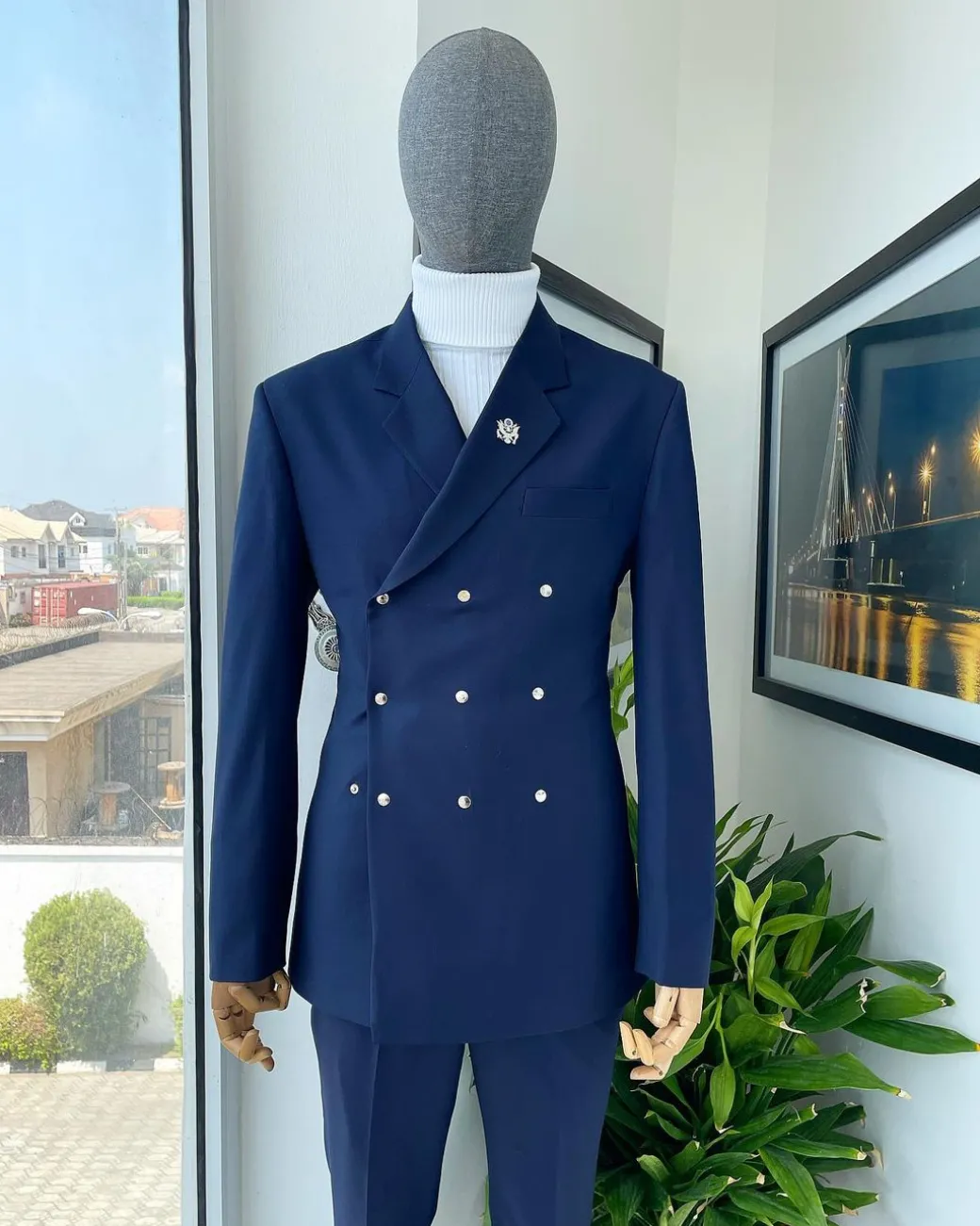 An Navy blue “ibiza” wrap suit with snap buttons detailing