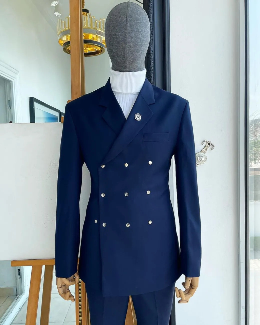 An Navy blue “ibiza” wrap suit with snap buttons detailing