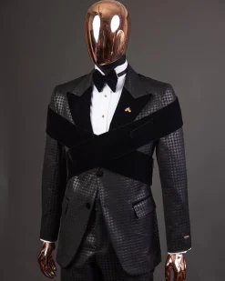 An “Octopus” black inverted square patterned metallic jacquard tuxedo with intersected black velvet peak lapel suit
