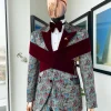 An “octopus” floral paisley tuxedo with intersected mahogany red soaked Italian velvet peak lapel suit