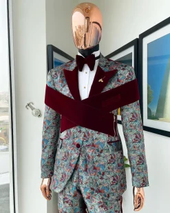 An “octopus” floral paisley tuxedo with intersected mahogany red soaked Italian velvet peak lapel suit