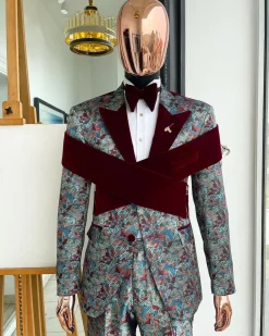 An “octopus” floral paisley tuxedo with intersected mahogany red soaked Italian velvet peak lapel suit