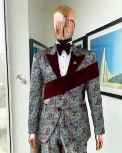 An “octopus” floral paisley tuxedo with left side strap mahogany red soaked Italian velvet peak lapel suit