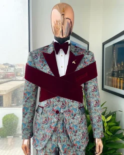 An “octopus” floral paisley tuxedo with intersected mahogany red soaked Italian velvet peak lapel suit