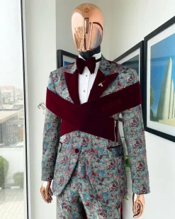 An “octopus” floral paisley tuxedo with intersected mahogany red soaked Italian velvet peak lapel suit