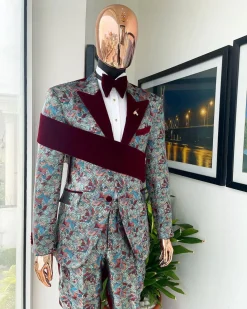 An “octopus” floral paisley tuxedo with right side strap mahogany red soaked Italian velvet peak lapel suit