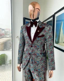 An “octopus” floral paisley tuxedo with right side strap mahogany red soaked Italian velvet peak lapel suit