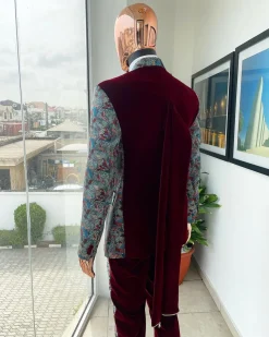 An “octopus” floral paisley tuxedo with intersected mahogany red soaked Italian velvet peak lapel suit