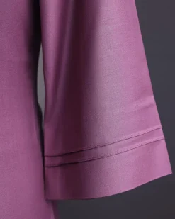 An orchid purple, pleated triangle with buckle intersection, 3/4 sleeve African senator kaftan native.
