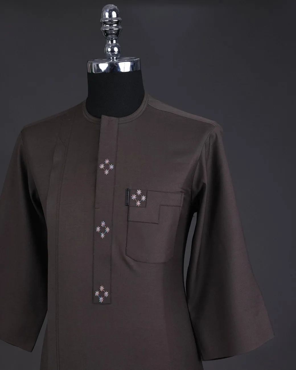 An Uber brown, front flap with connected stars, 3/4 sleeve African senator kaftan native.
