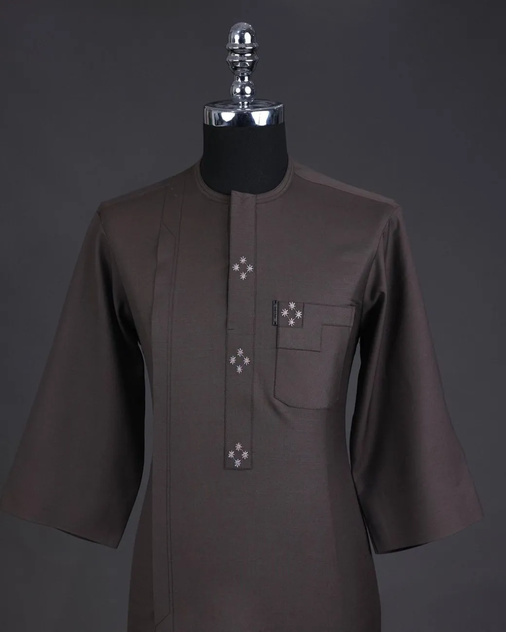 An Uber brown, front flap with connected stars, 3/4 sleeve African senator kaftan native.