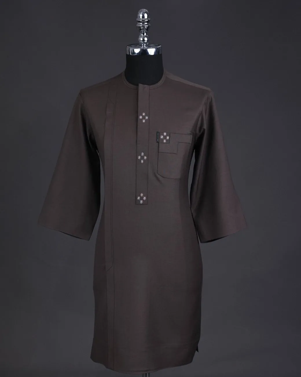 An Uber brown, front flap with connected stars, 3/4 sleeve African senator kaftan native.