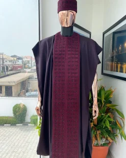 An Umber brown, connected square embroidery design with matching black and brown Swarovski stone details agbada, matching hat, buba & sokoto