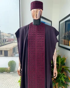 An Umber brown, connected square embroidery design with matching black and brown Swarovski stone details agbada, matching hat, buba & sokoto