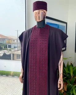 An Umber brown, connected square embroidery design with matching black and brown Swarovski stone details agbada, matching hat, buba & sokoto