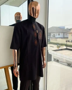An umber brown, 3D precision anchor embroidery flap and pocket detailing African traditional senator Kaftan native