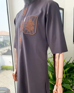 An umber brown, 3D precision anchor embroidery flap and pocket detailing African traditional senator Kaftan native