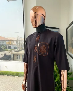 An umber brown, 3D precision anchor embroidery flap and pocket detailing African traditional senator Kaftan native
