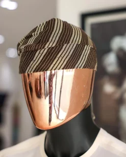 An umber brown Yoruba traditional African hat or fila