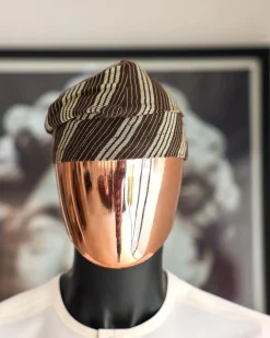 An umber brown Yoruba traditional African hat or fila