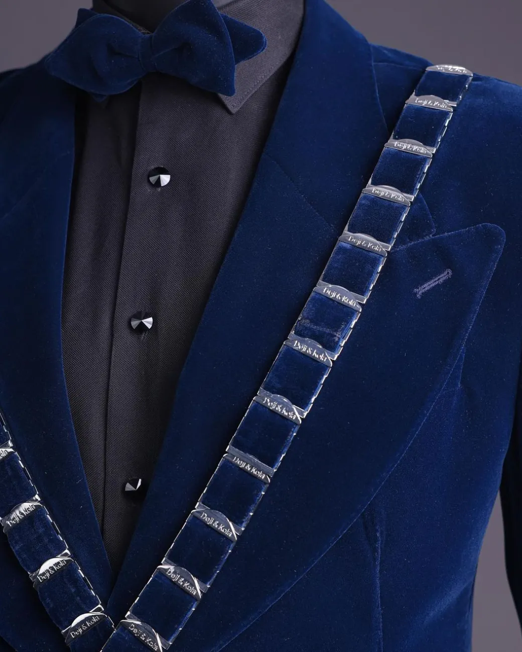 An “X” Midnight Blue, soaked velvet fabric, knitted, wide peak lapel tuxedo suit