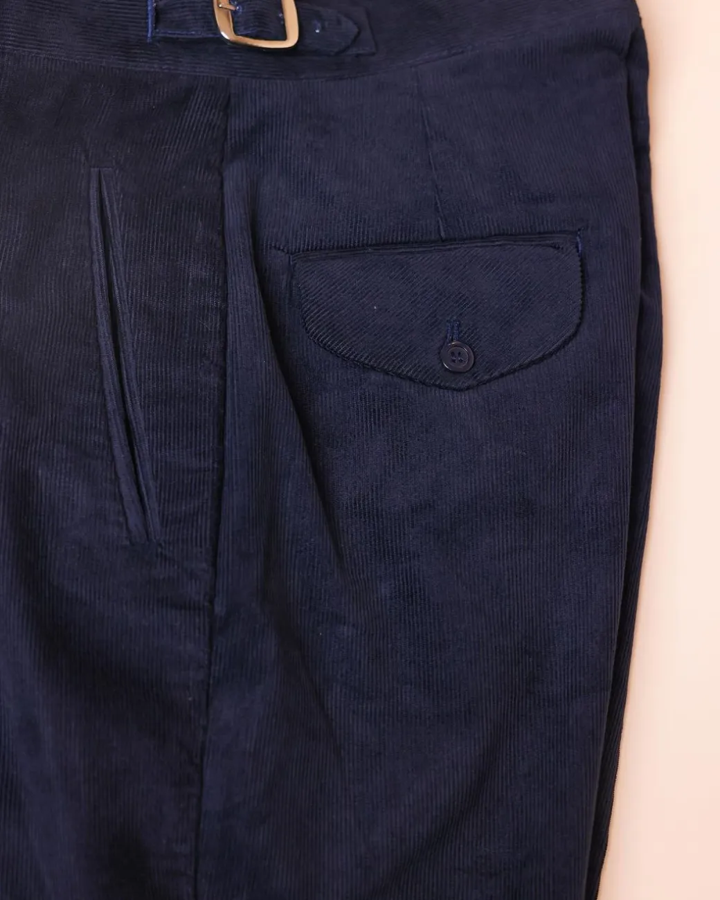 Gurkha trousers with pleats, double side strap buckles, slanted front welt pockets, and a back patch pocket.