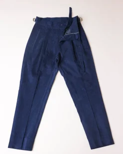 Gurkha trousers with pleats, double side strap buckles, slanted front welt pockets, and a back patch pocket.