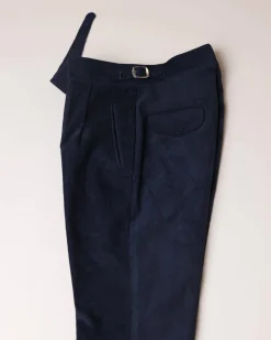 Gurkha trousers with pleats, double side strap buckles, slanted front welt pockets, and a back patch pocket.