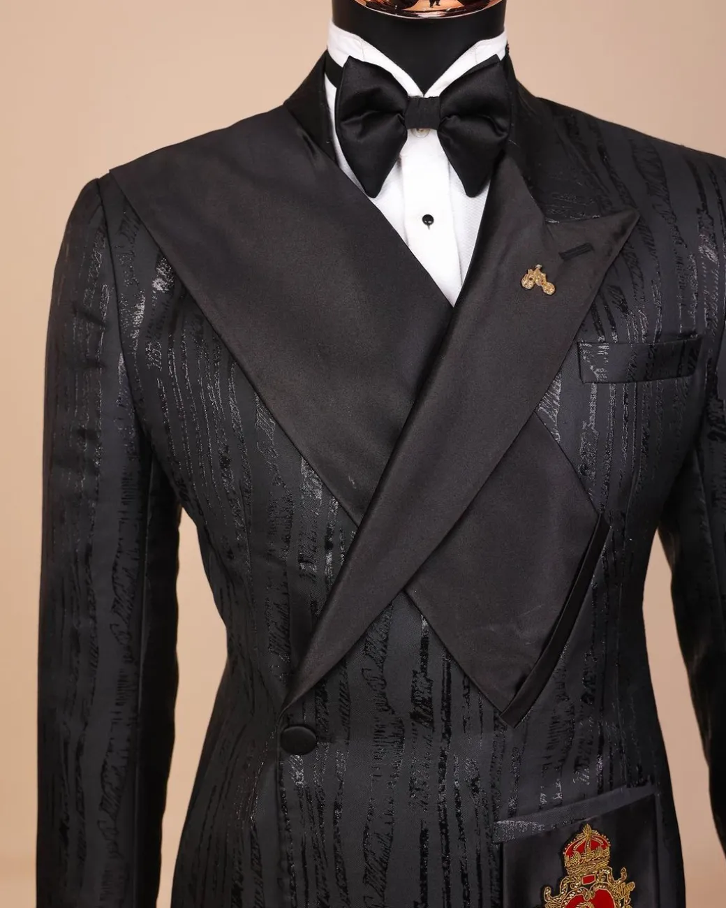 The “Da Vinci” charcoal black, metallic jacquard, single lapel, mid cut intersect strap tuxedo suit.