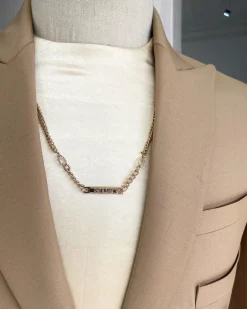 The “Diego Maradona” monochrome Champagne Gold peak lapel business suit