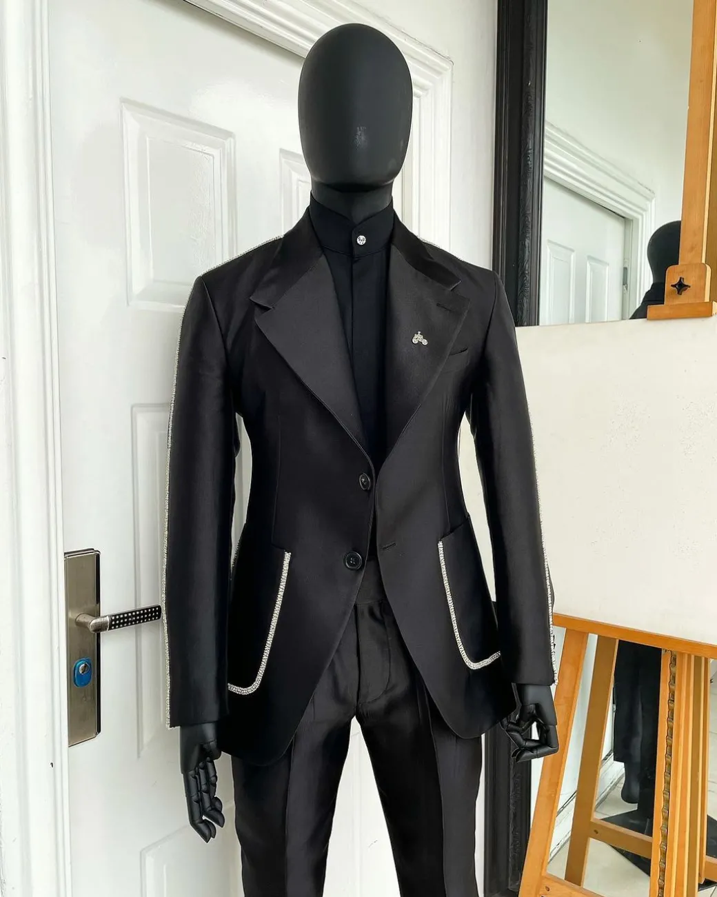 The Monochrome “okorodudu” mikado satin, charcoal black, big-notch lapel suit.