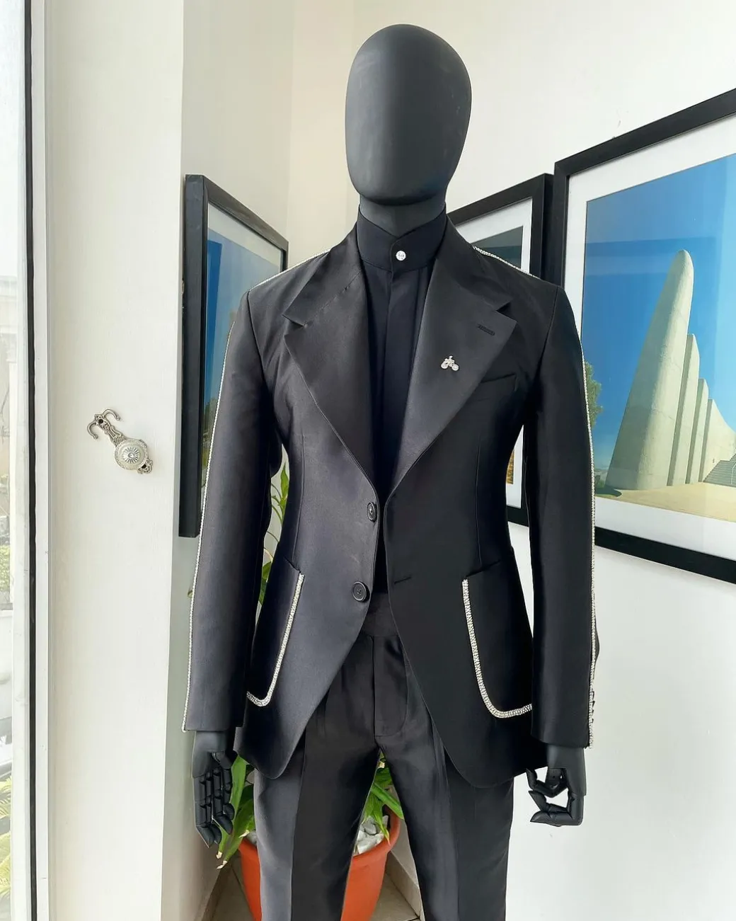 The Monochrome “okorodudu” mikado satin, charcoal black, big-notch lapel suit.