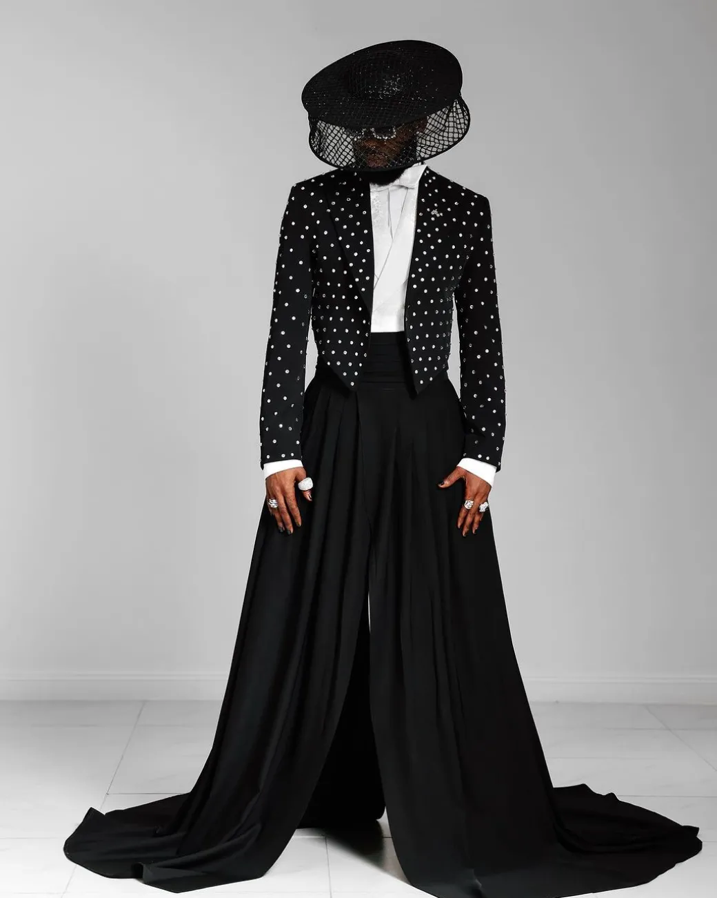 The ”Prince” Charcoal Black Short Peak Lapel Suit With ss30 Swarovski Stones, Double-breasted Waistcoat, High Pant Trousers & Pleated Long Tail Skirt.