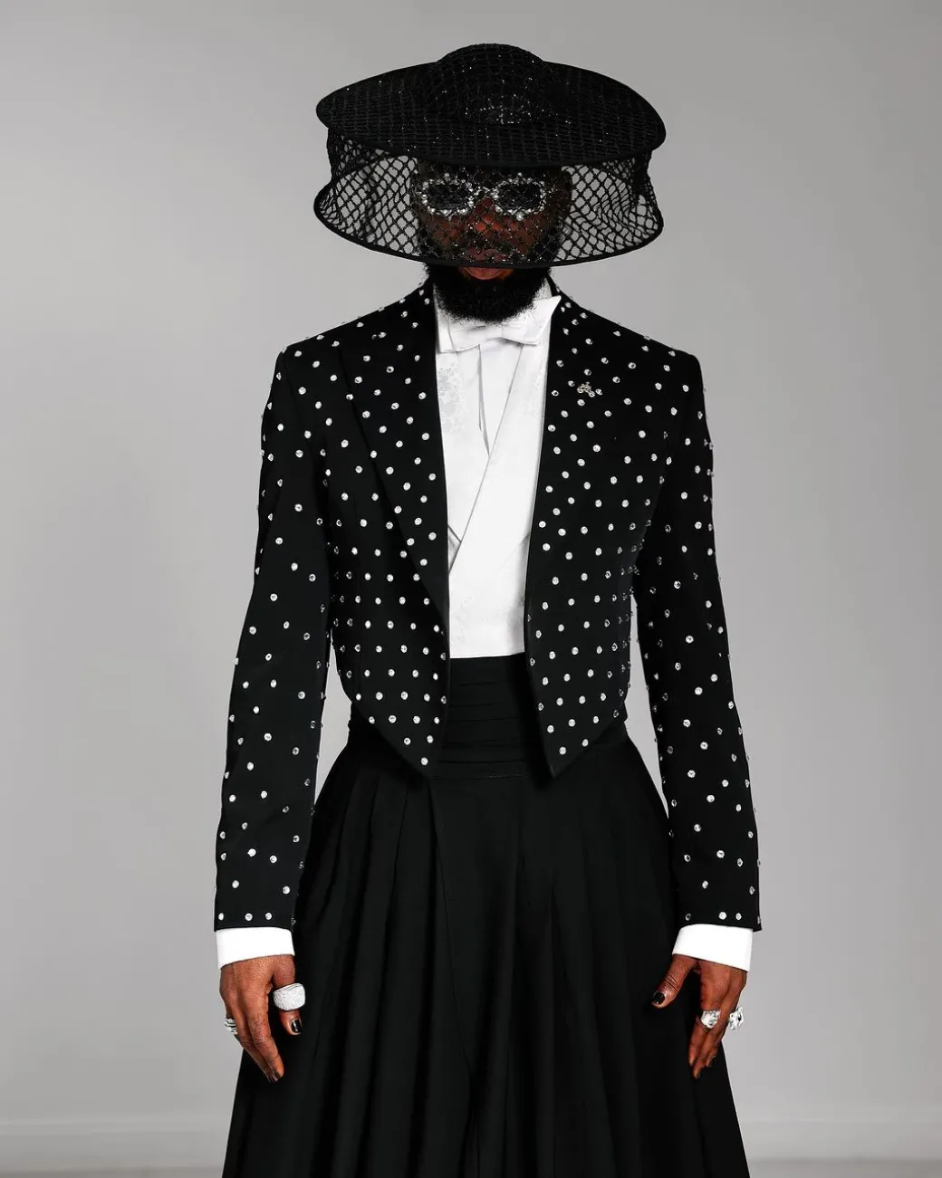 The ”Prince” Charcoal Black Short Peak Lapel Suit With ss30 Swarovski Stones, Double-breasted Waistcoat, High Pant Trousers & Pleated Long Tail Skirt.