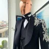 The “Trailblazers” charcoal black, shawl lapel tuxedo suit with metallic silver adornments