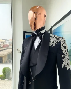 The “Trailblazers” charcoal black, shawl lapel tuxedo suit with metallic silver adornments