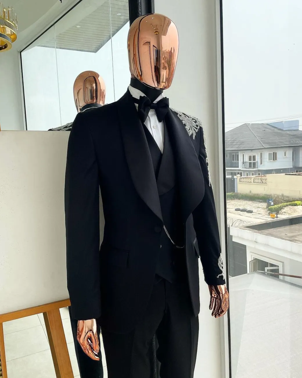 The “Trailblazers” charcoal black, shawl lapel tuxedo suit with metallic silver adornments
