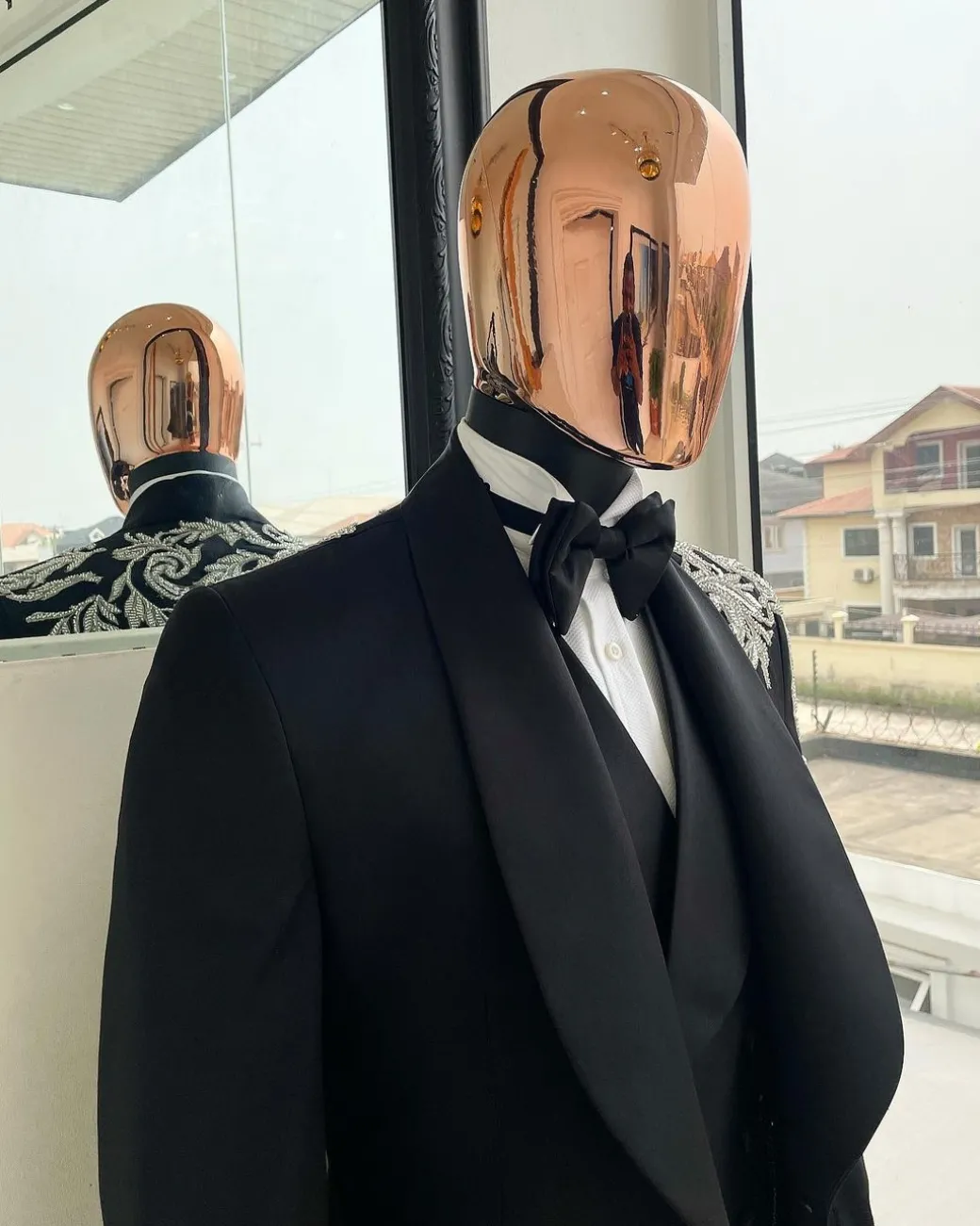 The “Trailblazers” charcoal black, shawl lapel tuxedo suit with metallic silver adornments